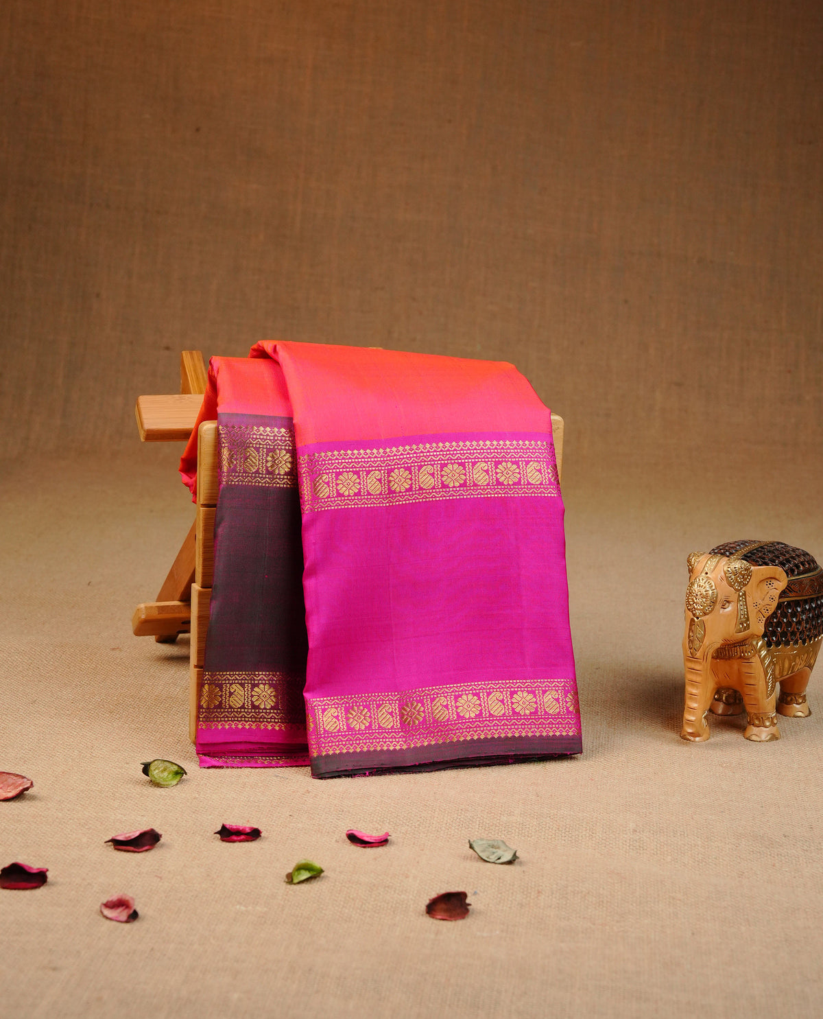 Orange colour traditional kancheepuram silk saree featuring Plain body, complemented by Magenta & Olive Double colour border, comes with matching blouse piece