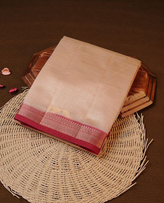 Cream colour Tussar silk saree Featuring Elegant Plain body, complemented by Contrast Maroon colour with gold zari border, paired with matching blouse piece.