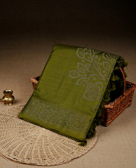 Olive colour banaras saree featuring Antique zari kodi pattern on body, complemented by Zari pattern on self colour border, comes with matching blouse piece.