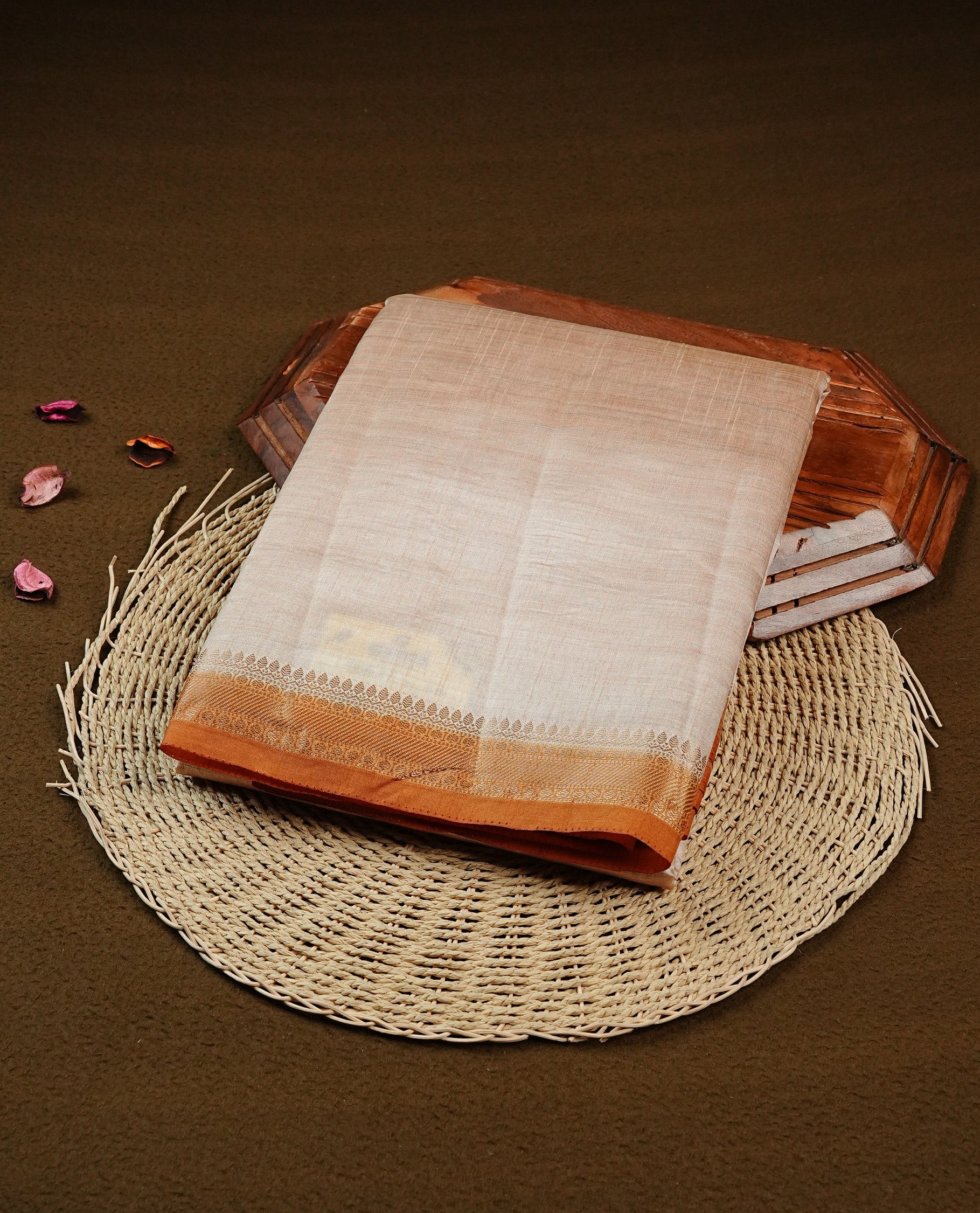 Light gold Colour Tussar saree featuring elegant plain body, complemented by contrast Mustard colour with zari work border, comes with matching blouse piece.