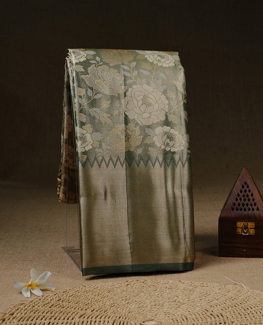 Light green colour Tissue silk saree featuring Gold & silver colour floral zari motifs on body, complemented by contrast Light green with gold zari border, paired with matching blouse piece.