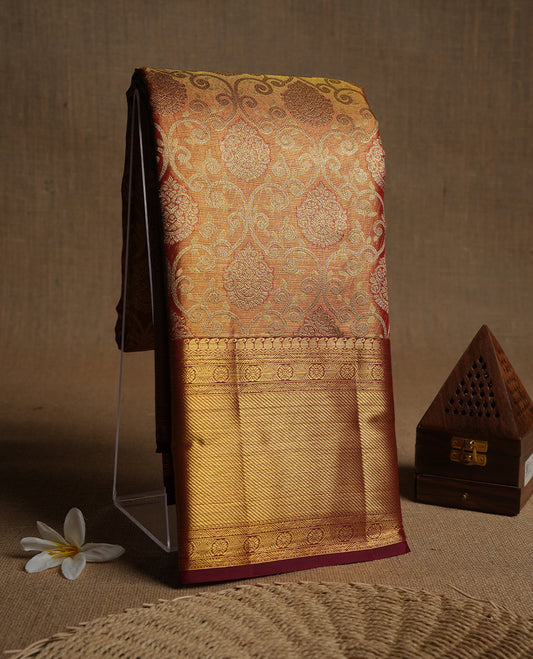 Red & gold double shade colour kancheepuram tissue silk saree highlighting gold kodi zari pattern body, with contrast maroon colour colour with traditional border and paired with matching blouse.
