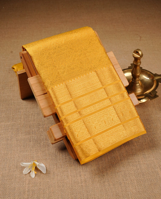 Yellow  Colour Pure Kancheepuram Silk Saree Featuring Gold Zari Kodi  Pattern on the Body, Highlighting a Traditional Gold Zari Border, Paired with a Matching Blouse Piece.