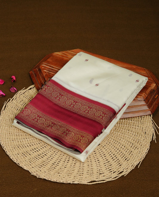 Off White  Colour Semi Silk Saree Featuring  Maroon thread buttas On Body, Highlighted  by contrast border with Mango motifs, paired with matching blouse piece.