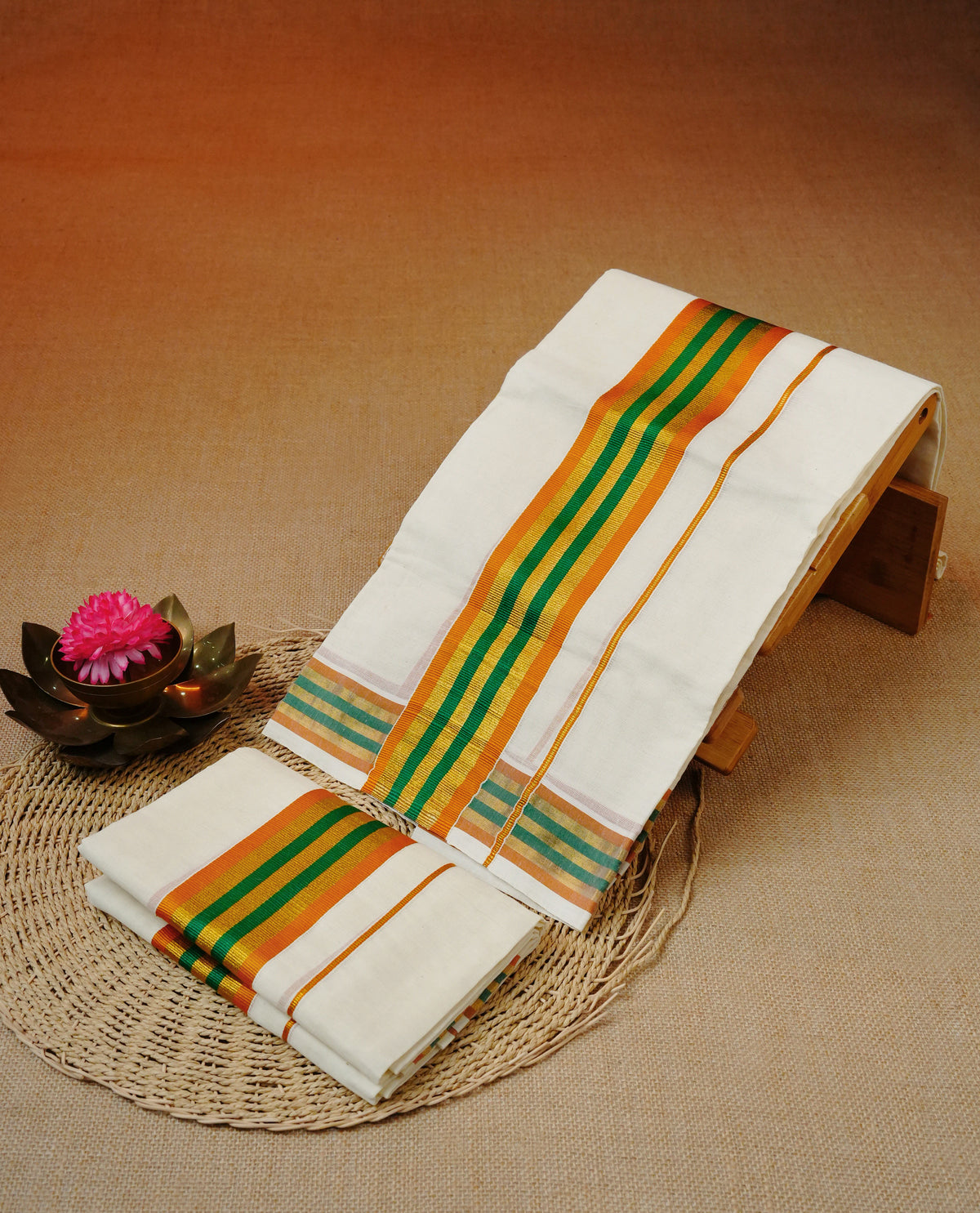 Cream colour cotton set mundu featuring gold & green, orange colour kara.