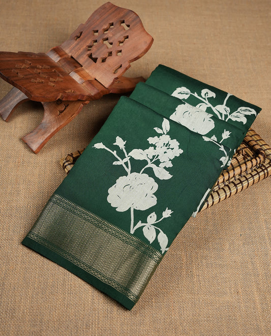Green colour Viscos semi printed saree featuring a light golden zari border, abstract off white printed motifs on the body, and comes with a matching blouse