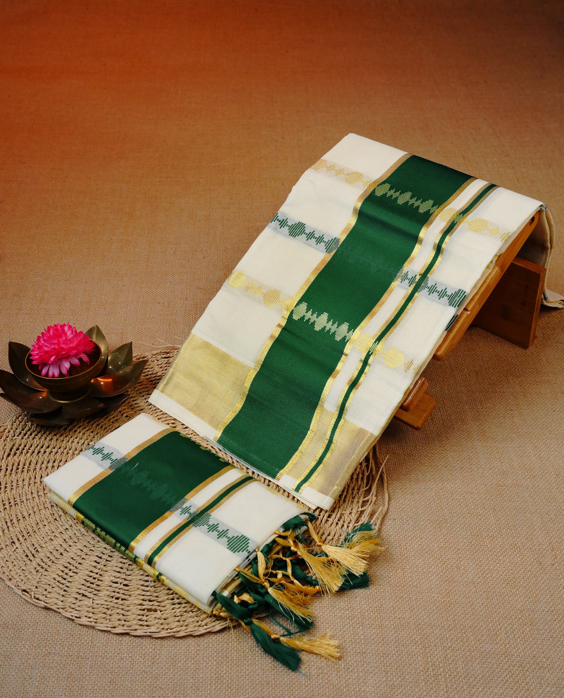 Cream colour cotton set mundu featuring Gold green colour strips on body, gold kasav with green kara.