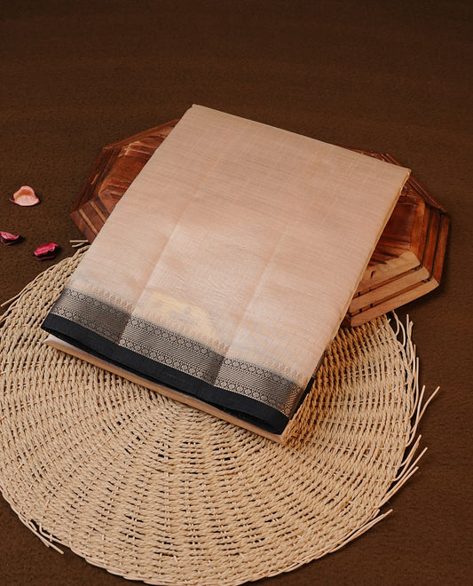 Cream colour Tussar silk saree Featuring Elegant Plain body, complemented by Contrast Black colour with gold zari border, paired with matching blouse piece.