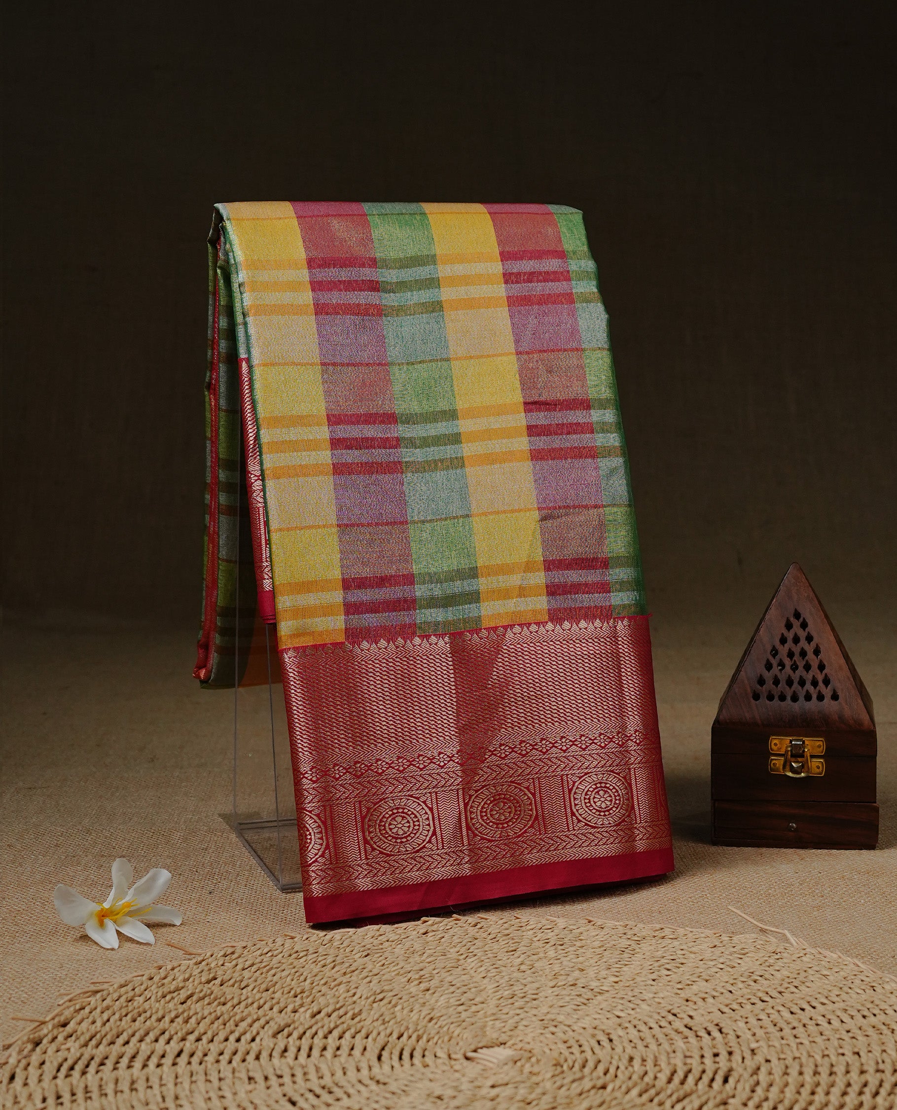 Green, Pink & Yellow Tissue Saree featuring Multi colour Check Design on body, complemented by contrast Red colour with Gold zari border, paired with matching blouse piece.