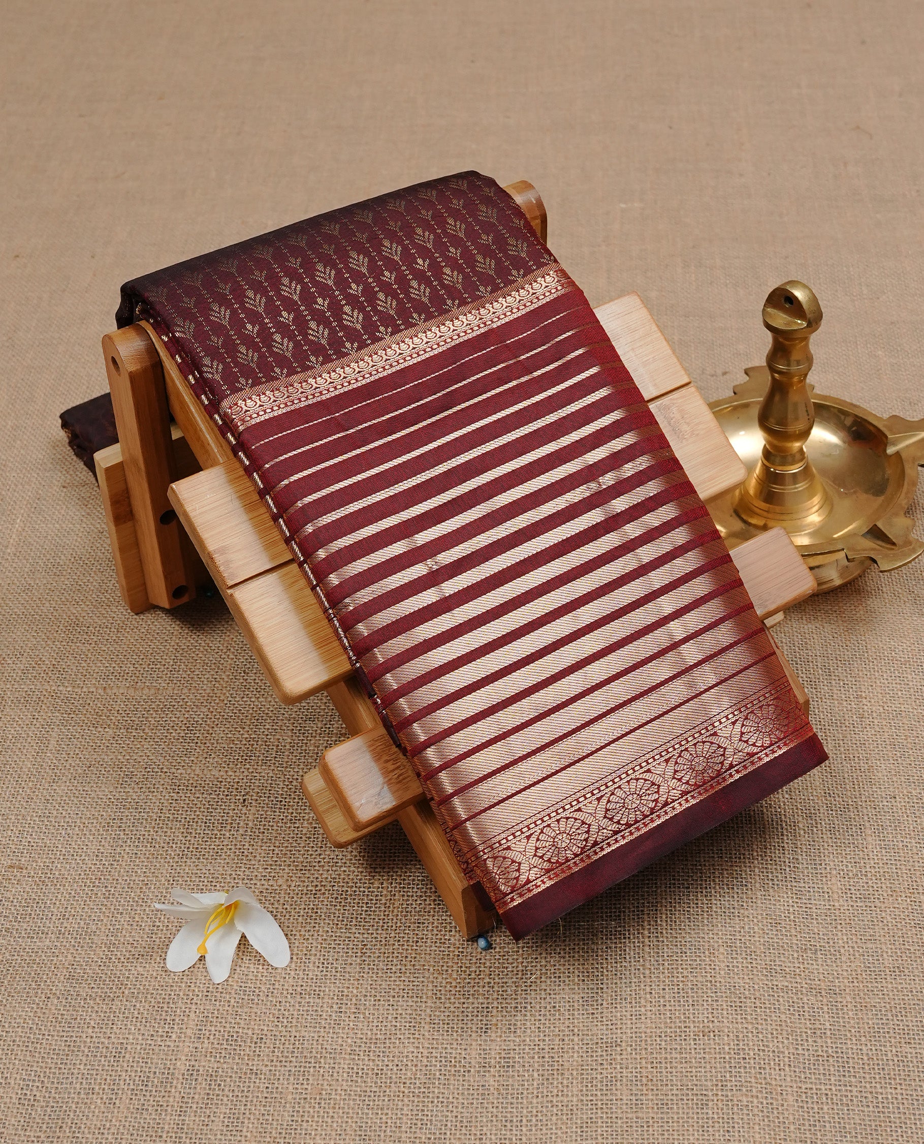 Chocolate Brown Colour Wedding Silk Saree Featuring Gold zari pattern on body, complemented by Gold Zari Strip pattern on self colour border, paired with matching blouse piece.