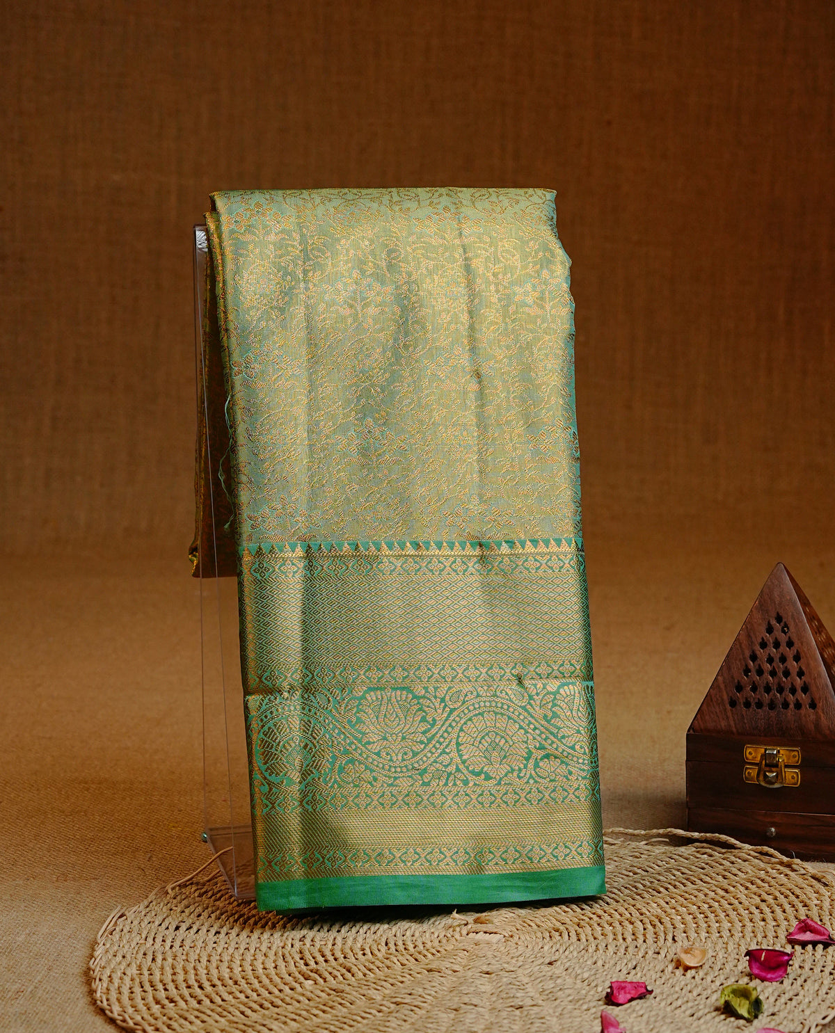 Green & Gold double shade colour Semi tissue silk saree featuring gold zari kodi floral motifs on body, Contrast Green colour with traditional border, paired with matching blouse piece.