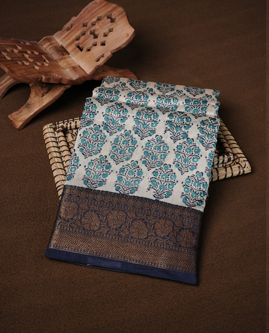 Beige Colour Chanderi silk saree featuring Block print on body, complemented by Contrast Dark Blue colour with Antique zari border, paired with matching blouse piece.
