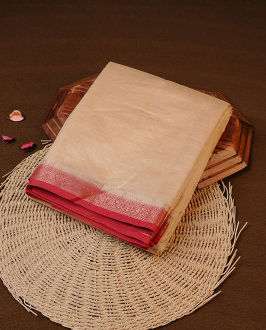 Cream colour Tussar silk saree Featuring Elegant Plain body, complemented by Contrast Red colour with gold zari border, paired with matching blouse piece.