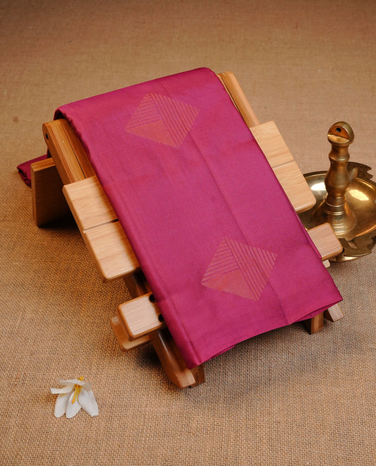 Dark Pink Colour Traditional Kancheepuram Silk Saree Featuring Copper Zari Diamond Motifs on the Body, Designed Without a Border and with a Grand Pallu, Paired with a Matching Blouse.