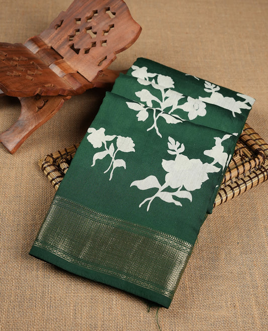 Green colour Viscos semi printed saree featuring a light golden zari border, abstract off white printed motifs on the body, and comes with a matching blouse