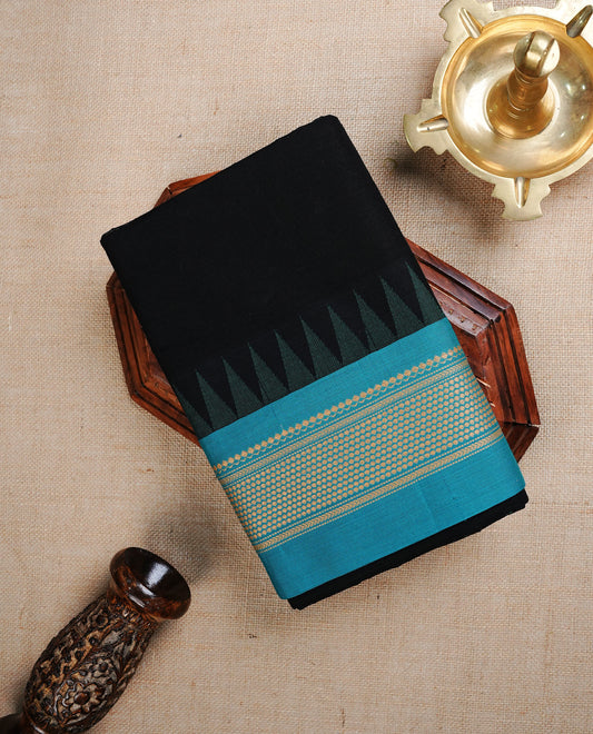 Black colour chettinad cotton saree featuring elegant plain body, complemented by contrast Aqua Colour with cream colour zari pattern on border, paired with matching blouse piece.