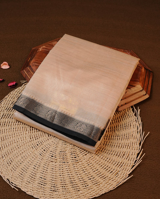 Cream colour Tussar silk saree Featuring Elegant Plain body, complemented by Contrast Black colour with gold zari border, paired with matching blouse piece.