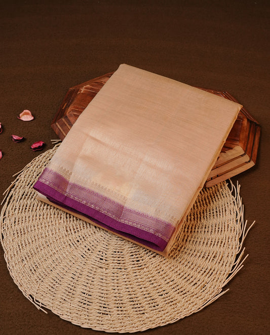 Cream colour Tussar silk saree Featuring Elegant Plain body, complemented by Contrast Purple colour with gold zari border, paired with matching blouse piece.