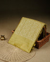 Mustard olive Colour banaras saree featuring Light gold zari Floral kodi pattern on body, complemented by borderless finish, comes with matching blouse piece.