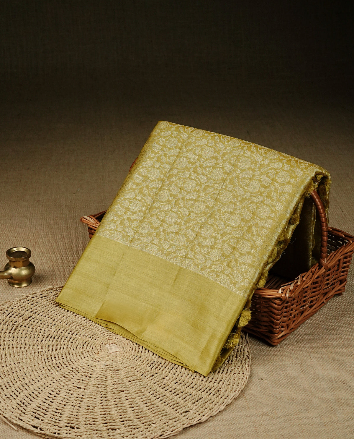 Mustard olive Colour banaras saree featuring Light gold zari Floral kodi pattern on body, complemented by borderless finish, comes with matching blouse piece.