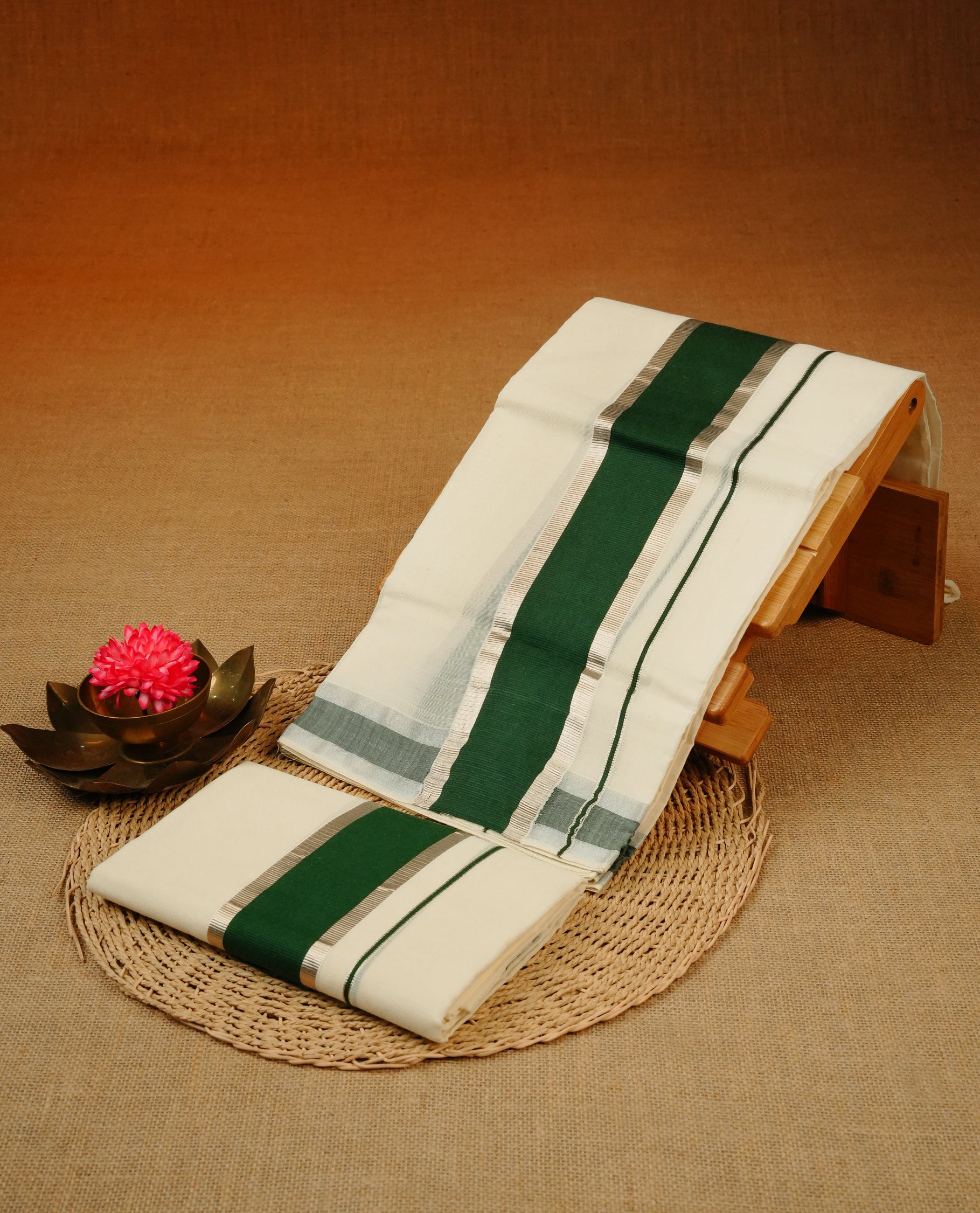 Cream colour Cotton set mundu With plain body, enhance Silver zari with Dark green kara.