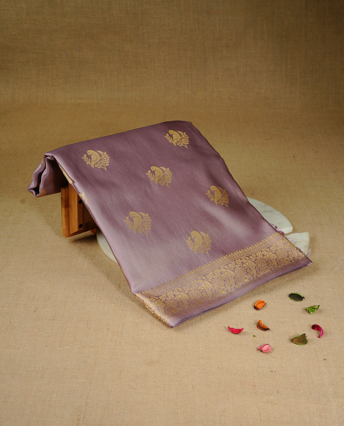 Pastel Lavender colour Mulberry silk saree featuring Gold zari bird motifs on body, complemented by self colour with gold zari border, comes with matching blouse piece.