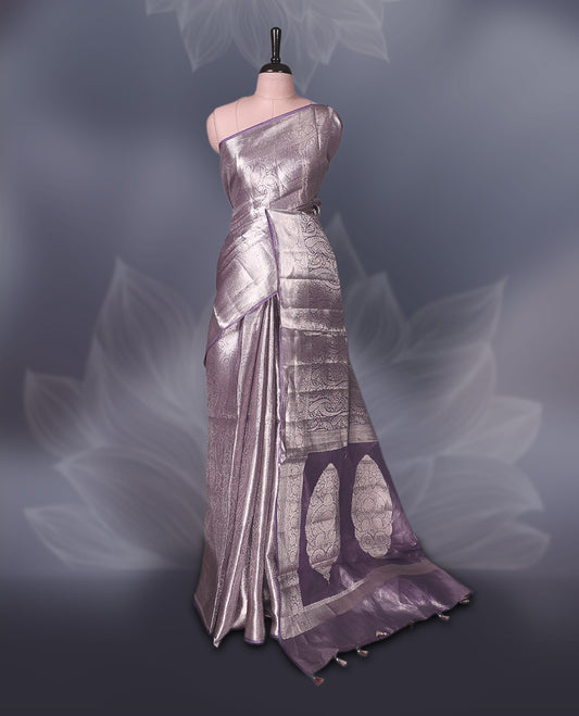 Lavender Pure tissue Banaras saree featuring intricate silver zari weaving all over with a rich pallu and bold paisley motifs, offering a luxurious drape perfect for weddings, festive occasions, and grand celebrations