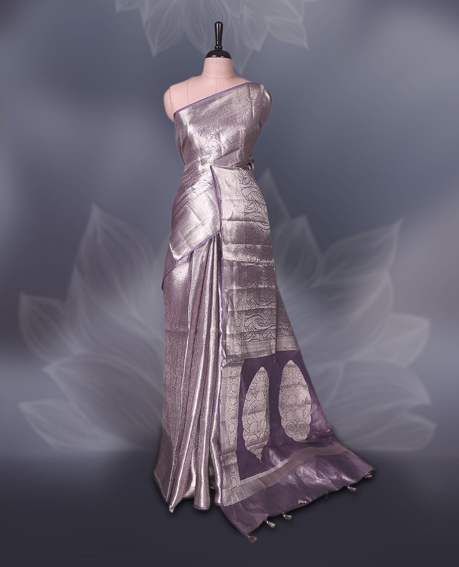 Lavender Pure tissue Banaras saree featuring intricate silver zari weaving all over with a rich pallu and bold paisley motifs, offering a luxurious drape perfect for weddings, festive occasions, and grand celebrations