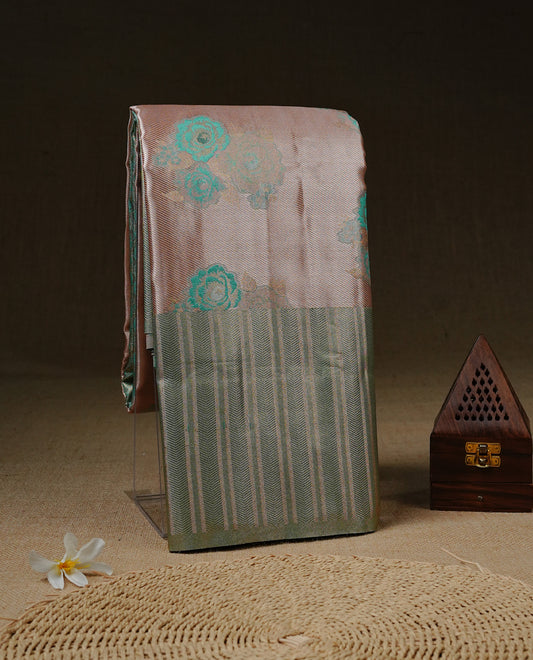 Light Pink colour Tissue silk saree featuring Green colour floral zari motifs on body, complemented by contrast Light green zari border, paired with matching blouse piece.