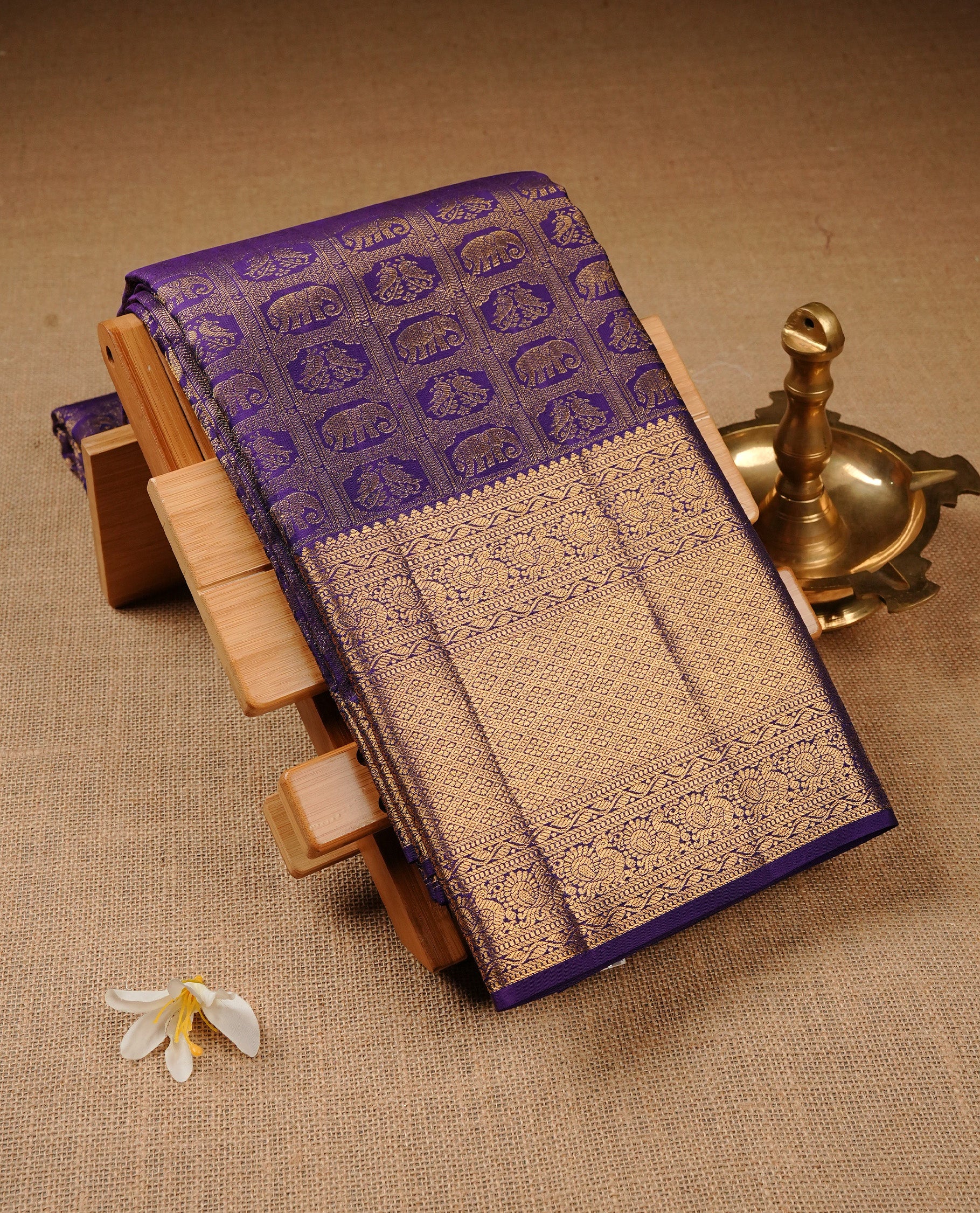 Violet Colour Pure Kancheepuram Silk Saree Featuring Gold Zari Elephant and Peacock  with a Check Pattern on the Body, Highlighting a Traditional Gold Zari Border, Paired with a Matching Blouse Piece.