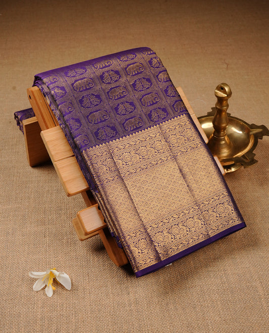 Violet Colour Pure Kancheepuram Silk Saree Featuring Gold Zari Elephant and Peacock  with a Check Pattern on the Body, Highlighting a Traditional Gold Zari Border, Paired with a Matching Blouse Piece.