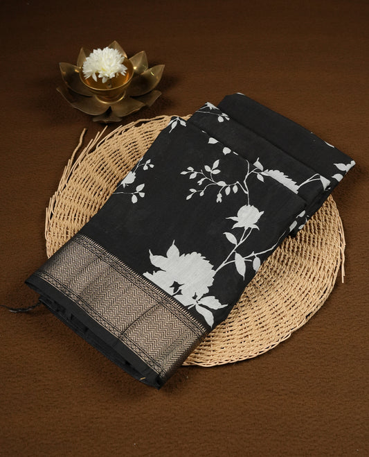 Black colour Viscos semi printed saree featuring a light golden zari border, abstract white printed motifs on the body, and comes with a matching blouse