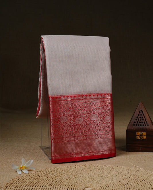 Light pinkish Cream colour Net Tissue saree Elegant plain body, complemented by Red colour with Light gold zari traditional border, paired  with matching blouse piece.