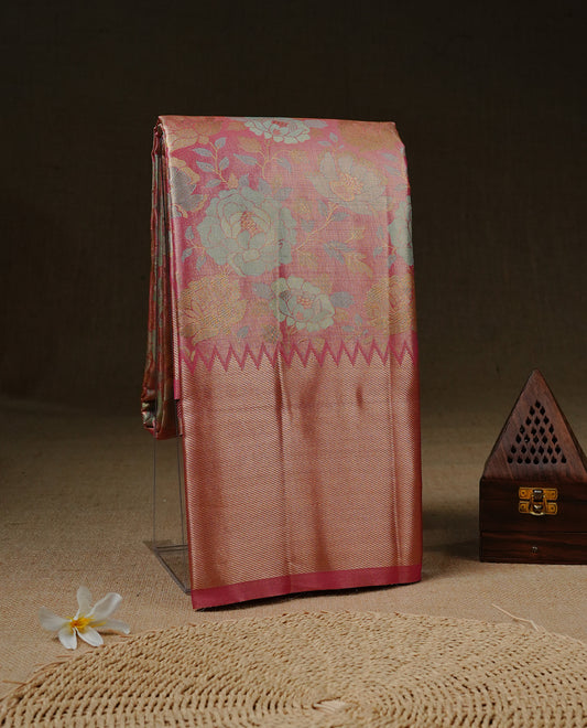 Pink colour Tissue saree featuirng Aqua, Gold, silver zari Scales design on body, complemented by traditional border on self colour, paired with matching blouse piece.