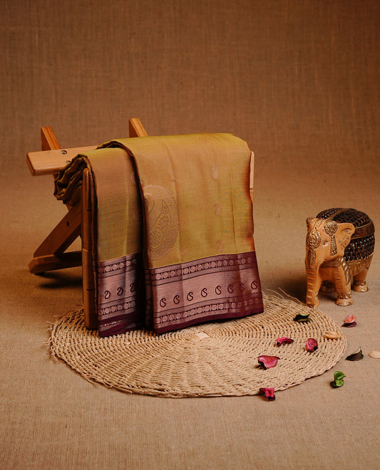 Olive Colour Traditional Kancheepuram  Silk Saree Featuring Gold Zari Mango Motifs on the Body, Complemented by a Contrast Maroon Colour  Gold Traditional Border and Pallu, Paired with a Matching Blouse .
