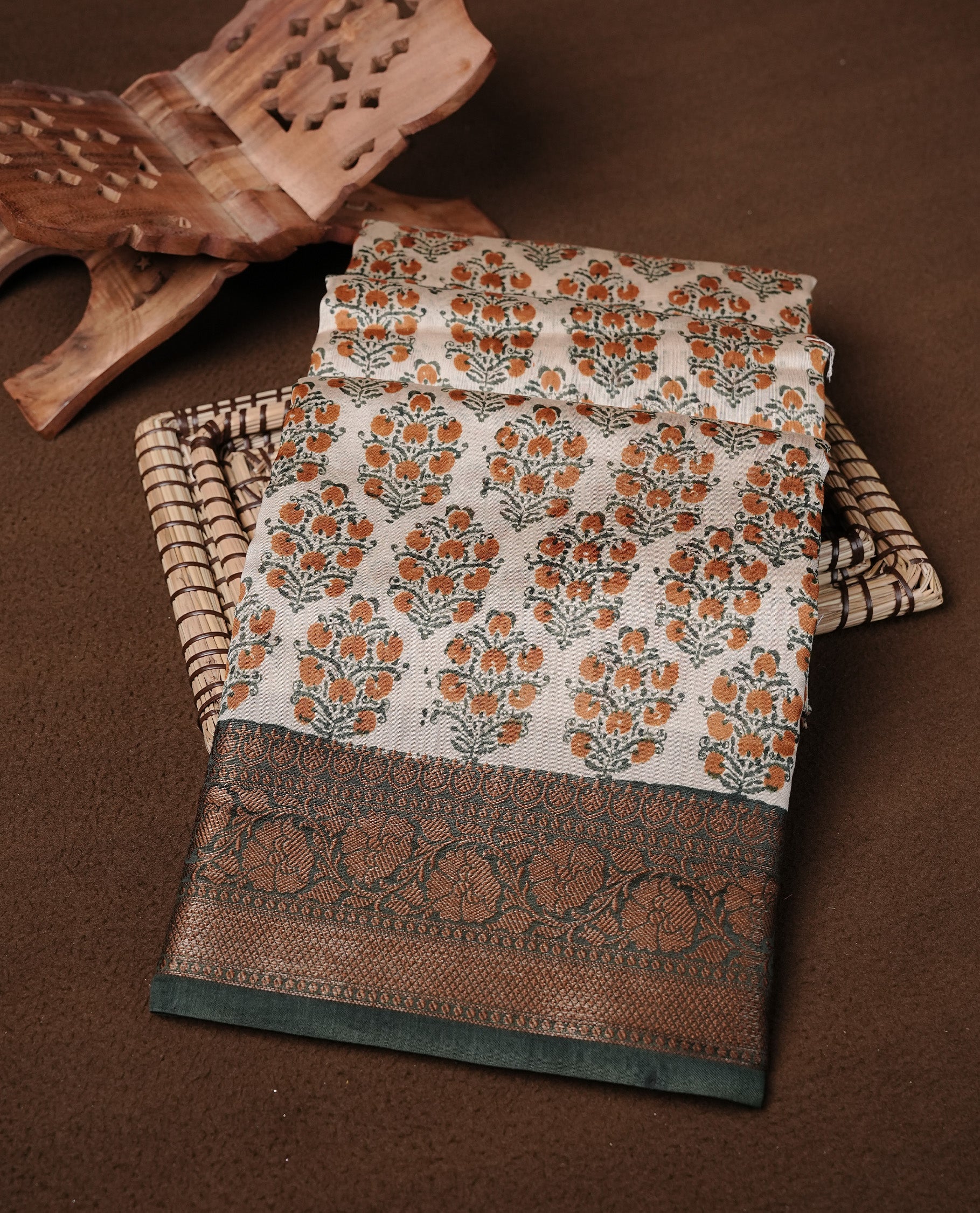 Beige Colour Chanderi silk saree featuring Block print on body, complemented by Contrast Dark Green colour with Antique zari border, paired with matching blouse piece.