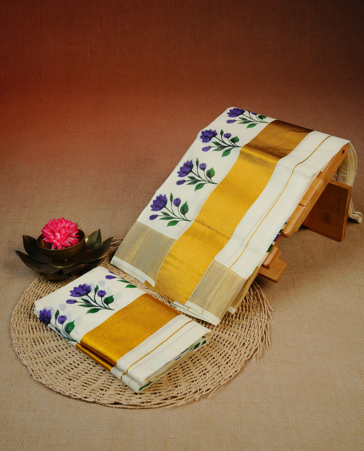 Cream colour cotton Set Mundu With Plain body, enhanced with gold Kasav With Purple flower Printed kara.