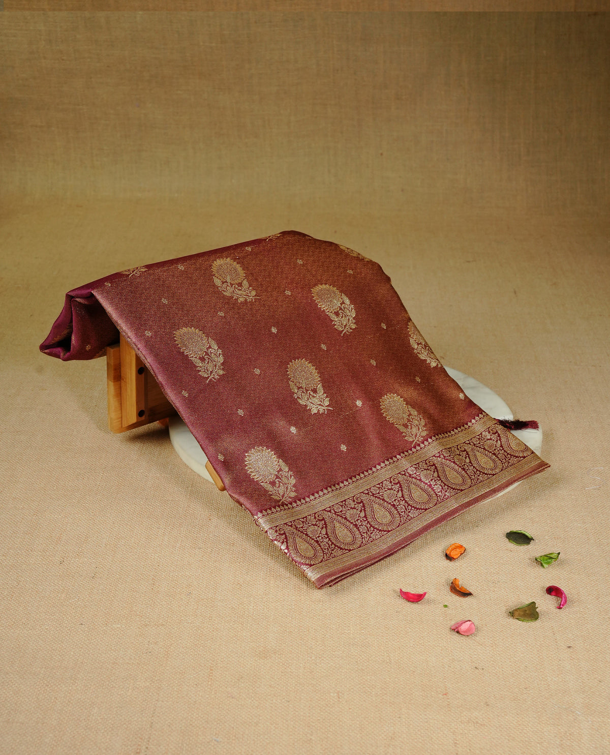 Maroon colour Mulberry silk saree featuring Gold zari small buttas & floral motifs  on body, complemented by self colour with Gold zari border, comes with matching blouse piece.