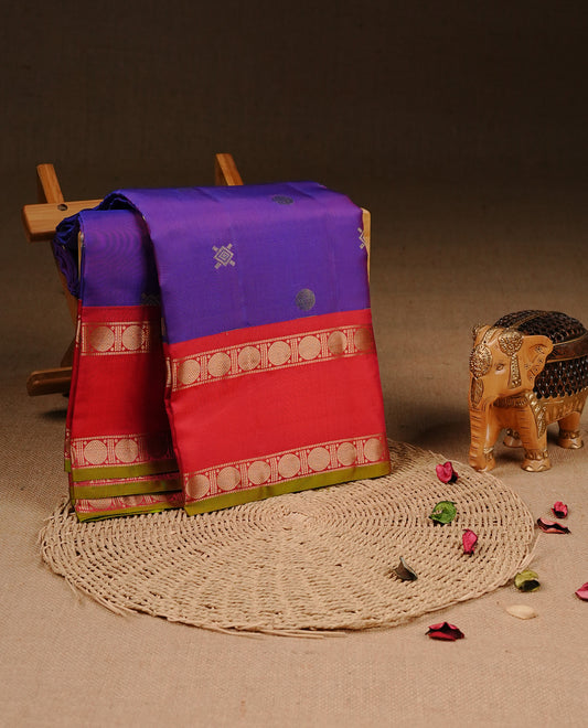 Peacock colour Traditional Kancheepuram silk saree featuring gold zari motifs on body, enhanced with contrast Red with traditional with green piping border, paired with matching blouse piece.