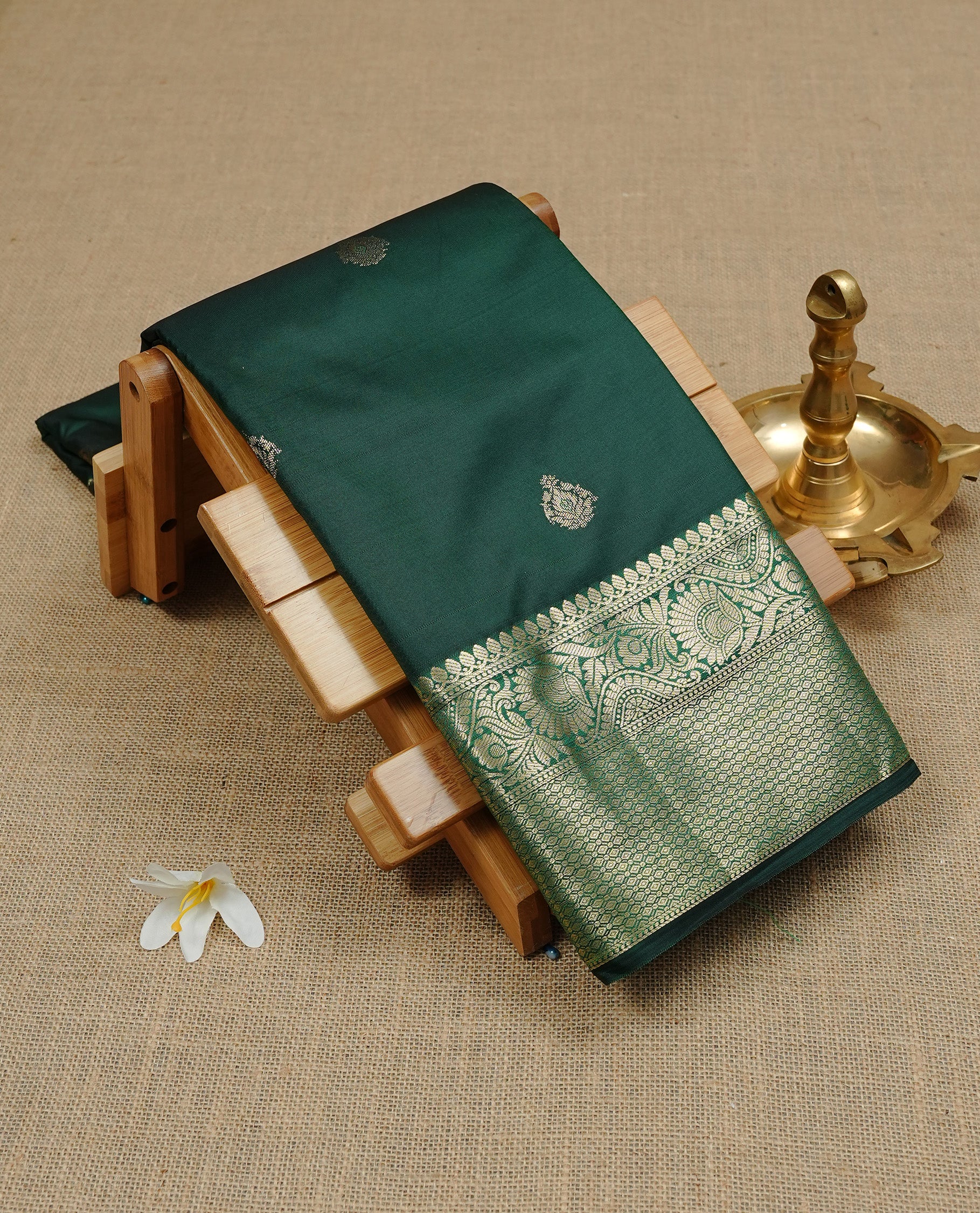 Green Semi Wedding Silk Saree featuring Gold Zari Motifs On body, Complemented with traditional zari with Self colour border, paired with matching blouse piece.