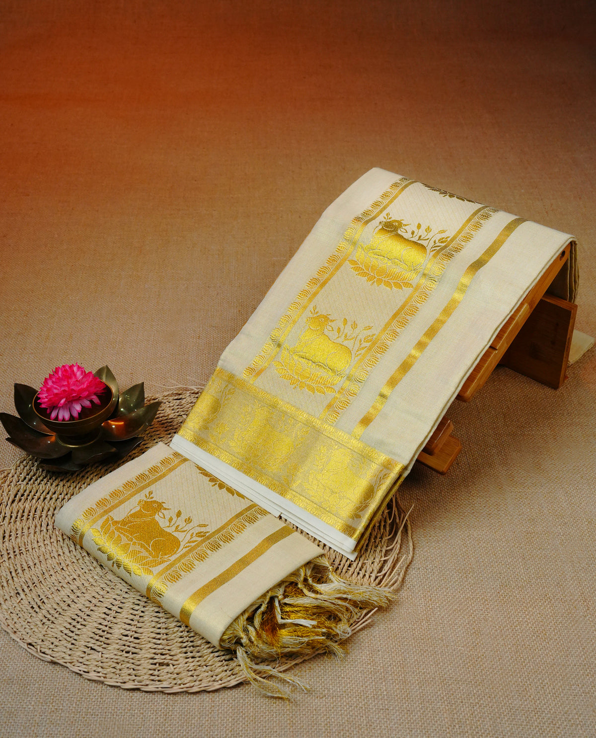 Light Gold Tissue set mundu featuring Gold zari design kara.