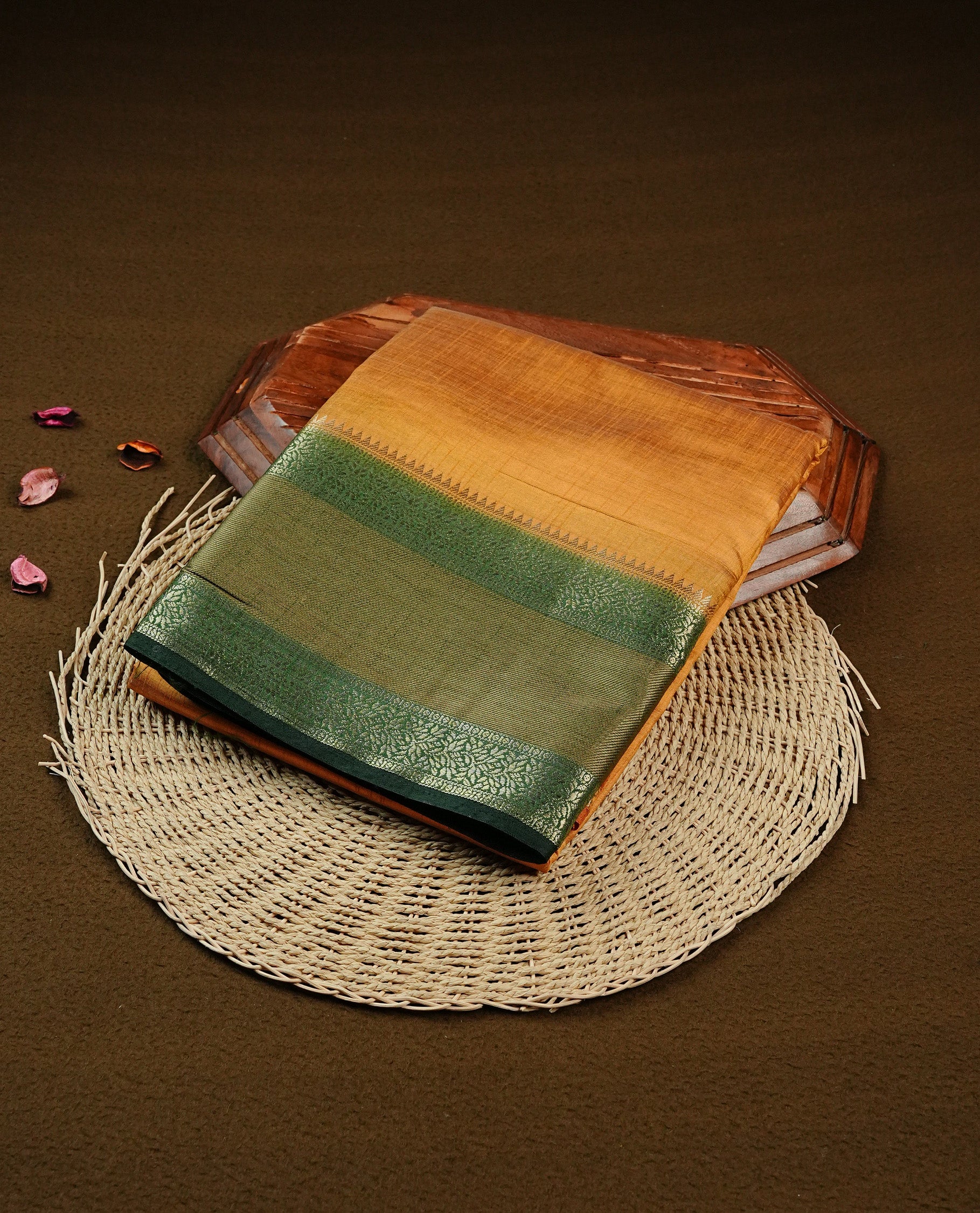 Mustard colour Tussar saree featuring Elegant plain body, complemented by Contrast Green colour with traditional border, comes with matching blouse piece.