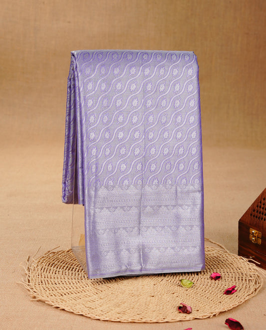 Lavender & Silver colour Double shade Semi tissue silk saree featuring self color kodi pattern on body, self colour with Fancy border, paired with matching.