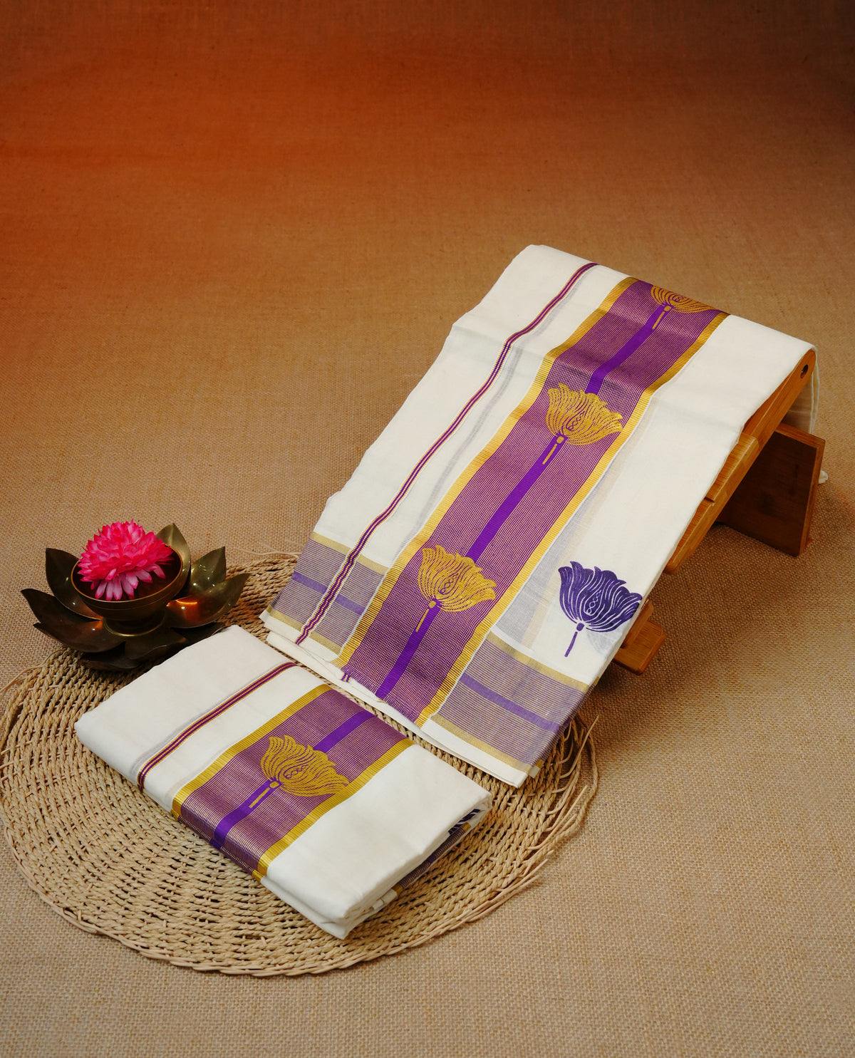 Cream colour cotton set mundu featuring Gold zari & purple border with floral Print.
