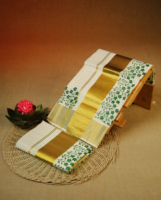 Cream colour cotton Set Mundu With gold zari check body, enhanced with Gold kasavu & Green colour floral print kara.