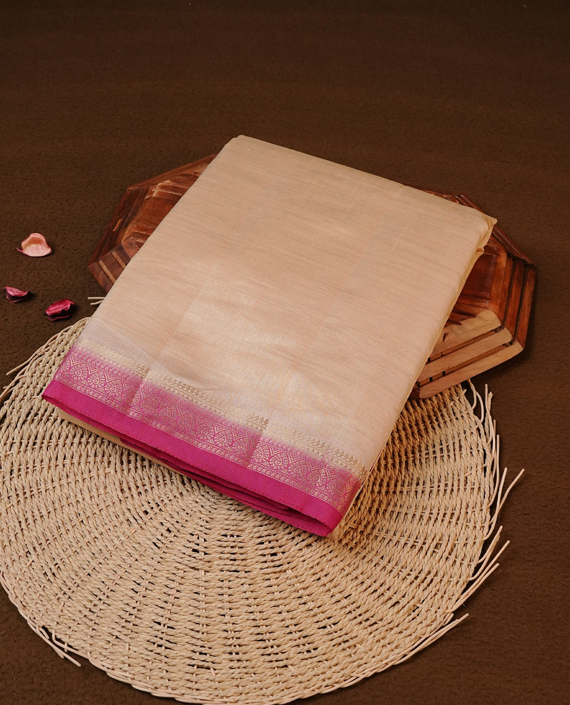 Cream colour Tussar silk saree featuirng Elegant Plain body, complemented by Contrast Magenta colour with gold zari border, paired with matching blouse piece.