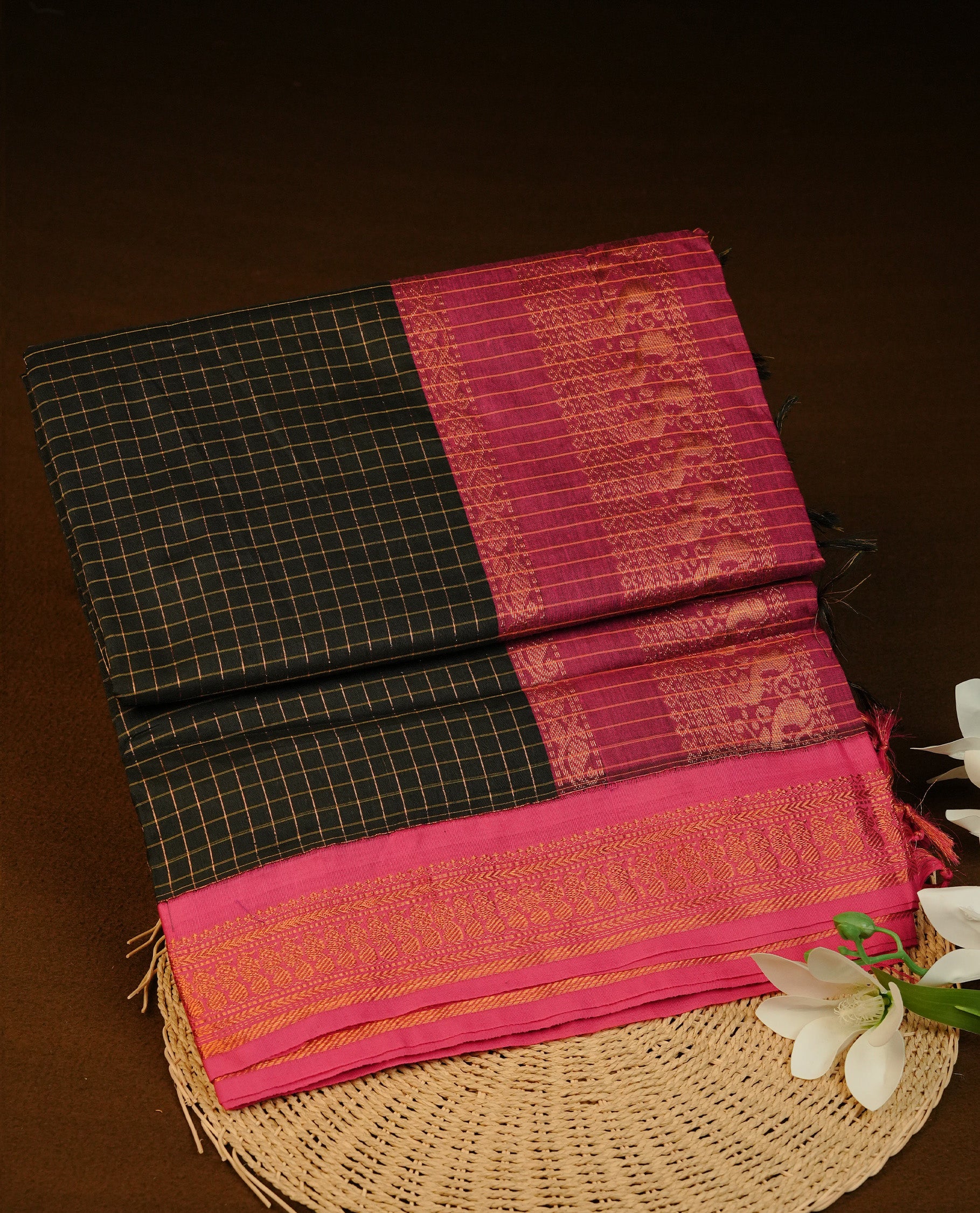 Black colour Kalyani cotton saree featuring Gold zari check pattern on body, complemented by Contrast Purple colour with grand gold zari border & pallu, matching blouse piece