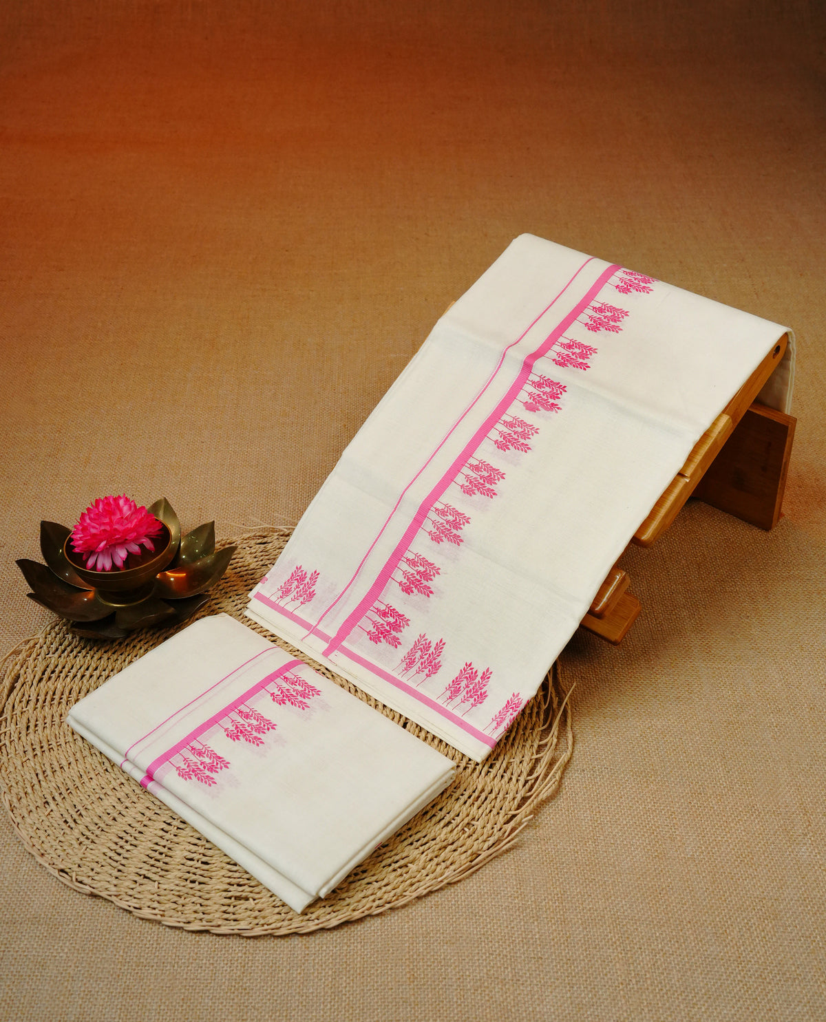 Cream colour cotton set mundu featuring Pink kara with print.