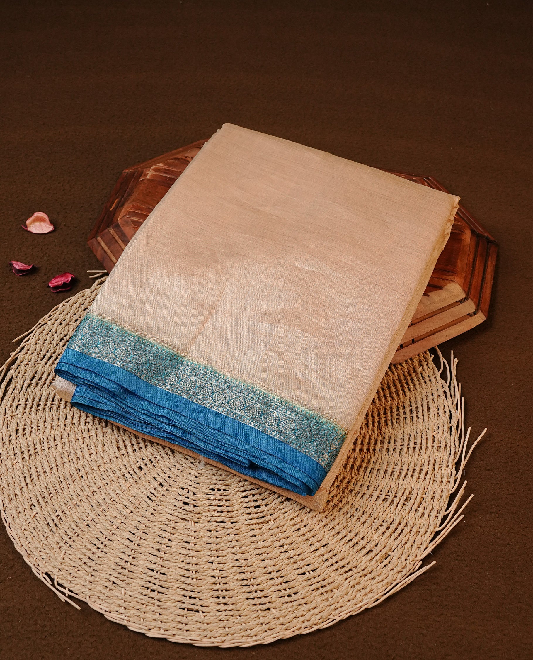 Cream colour Tussar silk saree Featuring Elegant Plain body, complemented by Contrast Blue colour with gold zari border, paired with matching blouse piece.