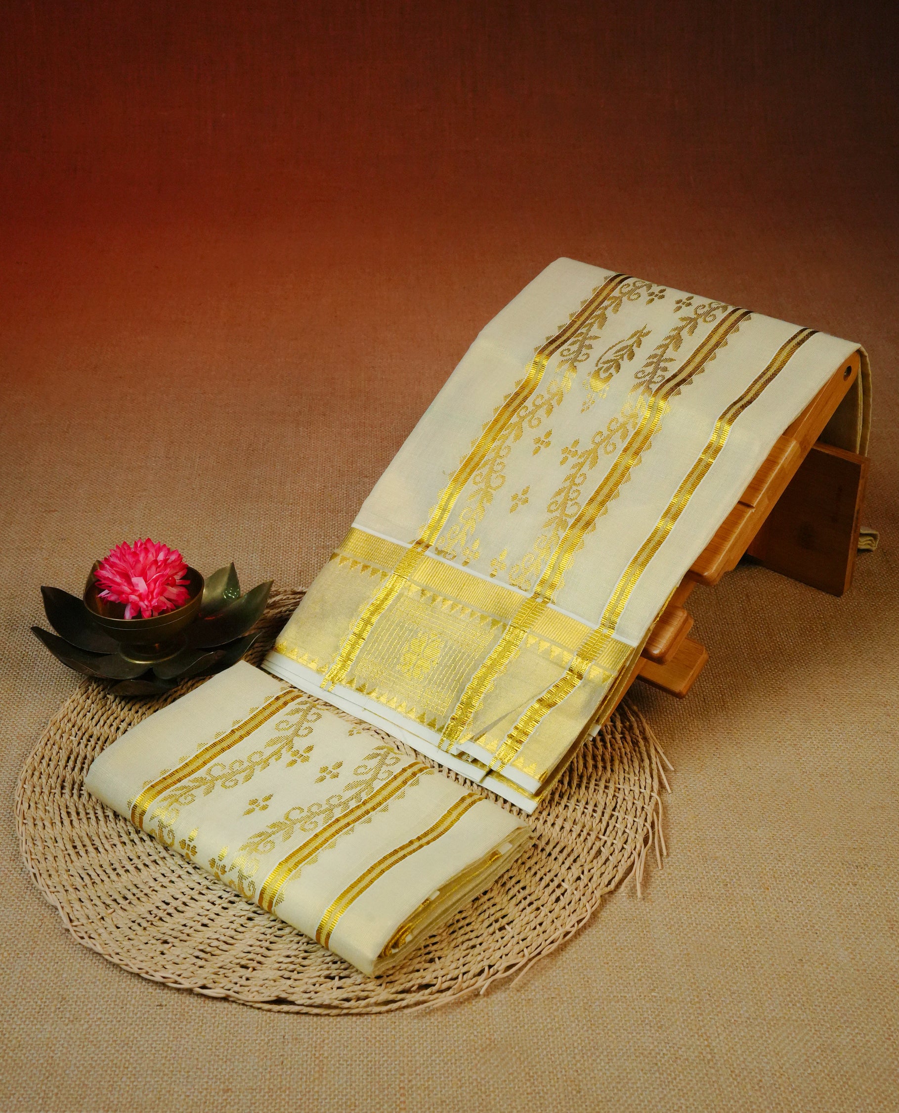 Cream tissue set mundu featuring a Plain body, enhanced with intricate gold zari detailing on the kara